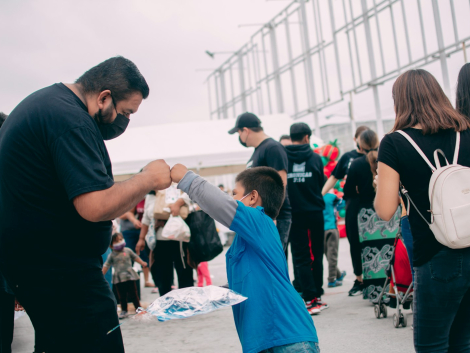 a group of people standing next to each other