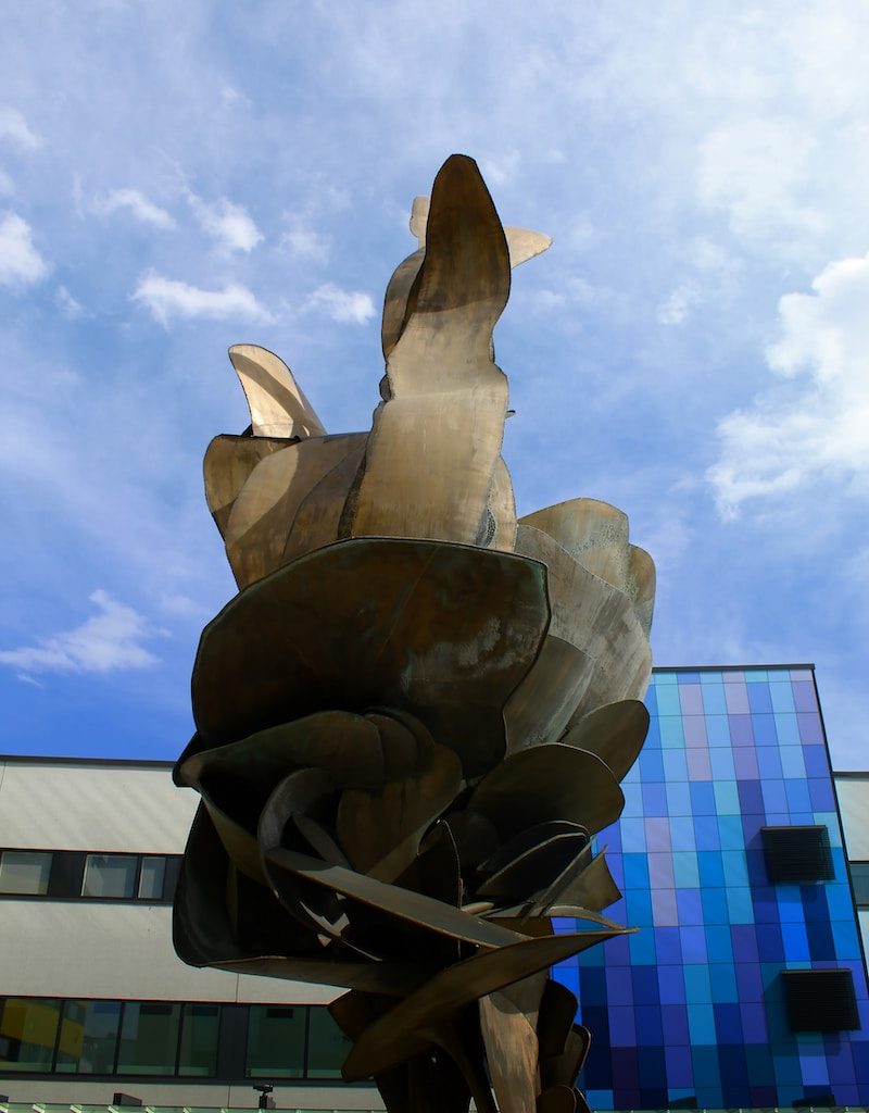 white concrete statue under blue sky during daytime