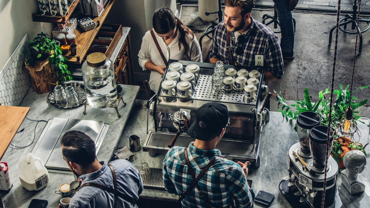 man buying coffee on counter