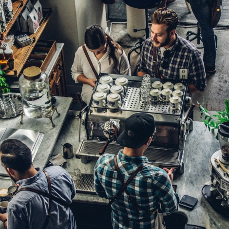 man buying coffee on counter